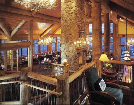 The soaring windows in the main dining room frame views of the Gore Range while the crackling fireplace creates a comfortable atmosphere.
