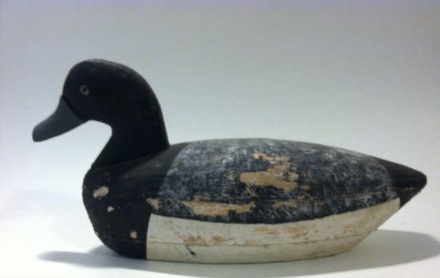 Lightly charred, this is one of the few decoys saved from the terrible fire that consumed the club.