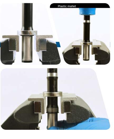 Spray isopropyl alcohol onto the axle and clean the axle with a rag. Notice: To avoid damage to the axle, do not allow the axle to contact the vise soft jaws.