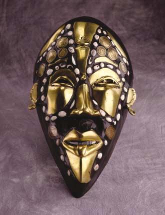 CAMEROON Wooden mask inlaid with brass, coins, and shells a traditional Cameroonian