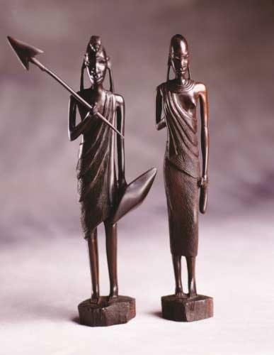 TANZANIA Two wooden figurines (male and female) representing the people of Tanzania.