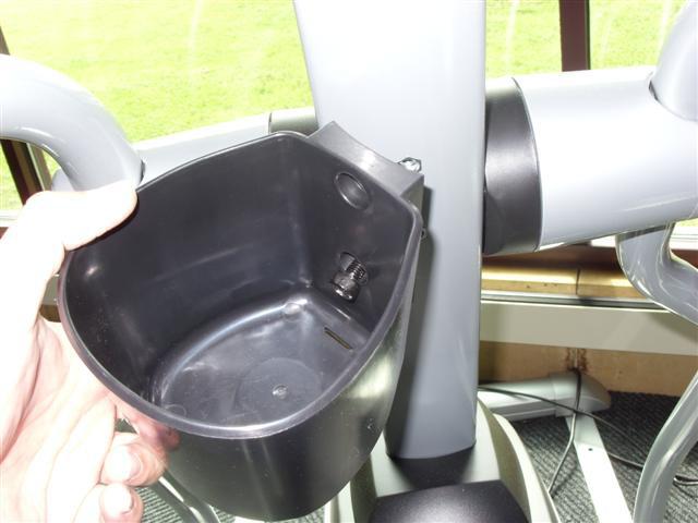 cup holder to the console mast (Figure A).