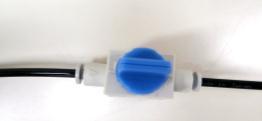 To release the tube from the port, push in the grey plastic washer surrounding the tubing, then pull out the tubing. 2.