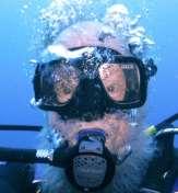 Through the years there have been many attempt to store the snorkel (yellow snorkel in picture) off the mask during the dive, but this was cumbersome.