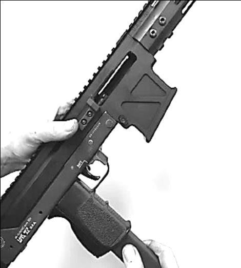 4) If the magazine does not latch in, apply light upward pressure while pulling the charging handle further rearward.