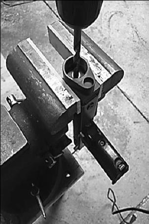 5) An electric hand drill is sufficient for drilling through the rear of the lower receiver. 6) Use cutting oil on the 5/16" (.312") drill bit and low RPM's to drill the hole.