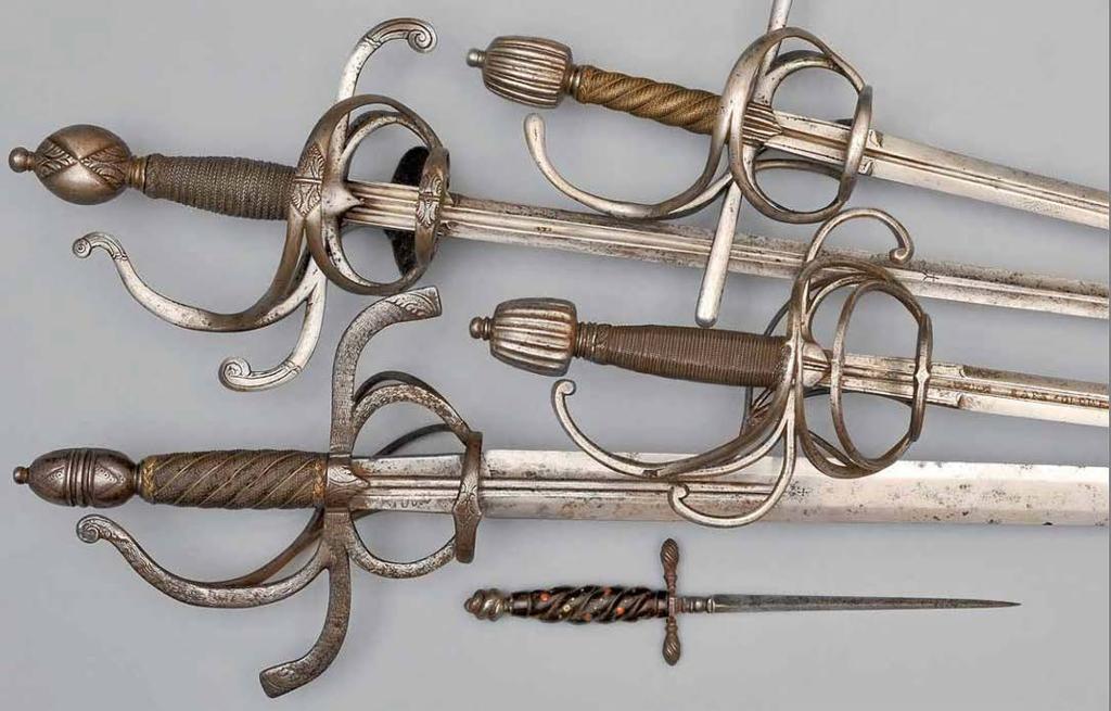 Rapier, German, around 1580. Iron guard. Spiral grip covering of twisted-cord brass wire. Blade with wolf mark. Rapier, German, around 1580.
