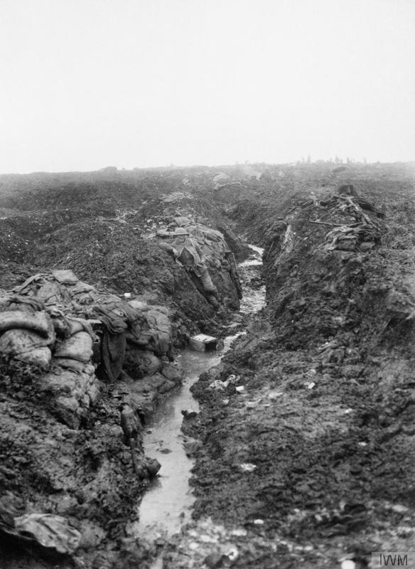 British troops manhandling a field gun through the mud Photos.