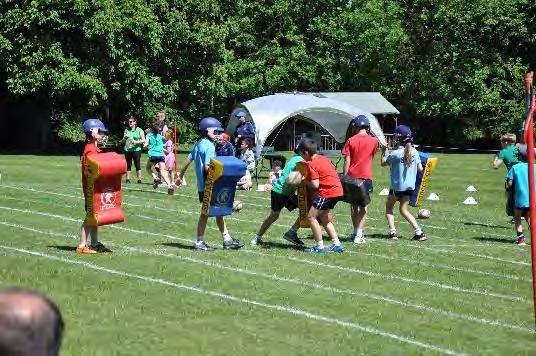 00pm, the St Edmund s Prep Athletics Track was ablaze with colour, reds for Campion, greens