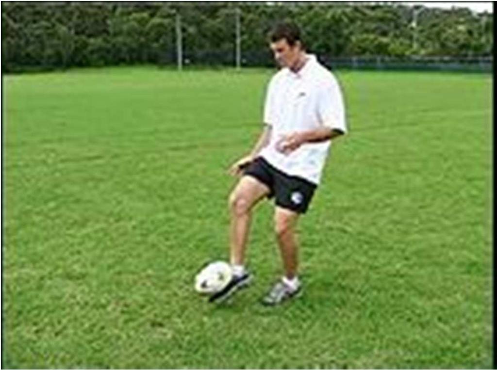 - The kicking foot makes contact with the ball comfortably close to the body