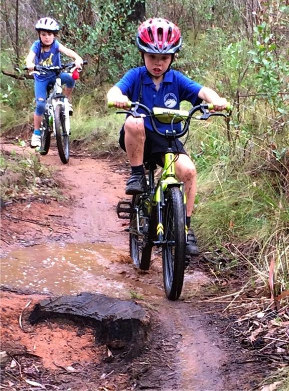 Axel Mero and Rosie Franzke dodge the puddles as they ride