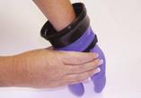 Bring your fingers together in a pointed cone and put them through the WristDam on the ZipGlove- WD.