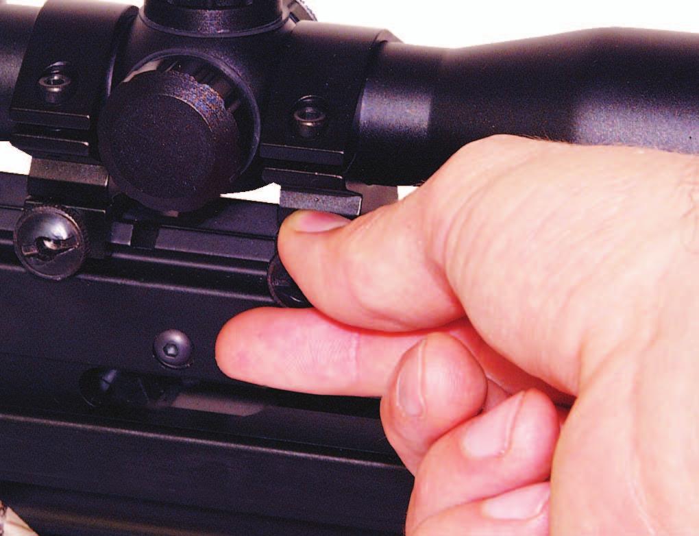 Draw string back towards trigger mechanism, (with eir rope cocking device or your hands) ensuring
