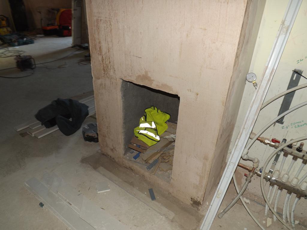 P14) Fireplace completely parged before