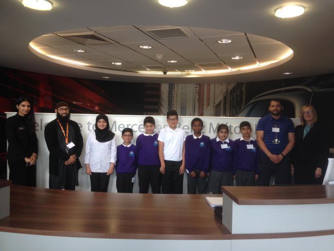 We were given some visitor badges that we placed on our well-presented uniform and had our picture taken at the front desk with some of the staff who worked there.