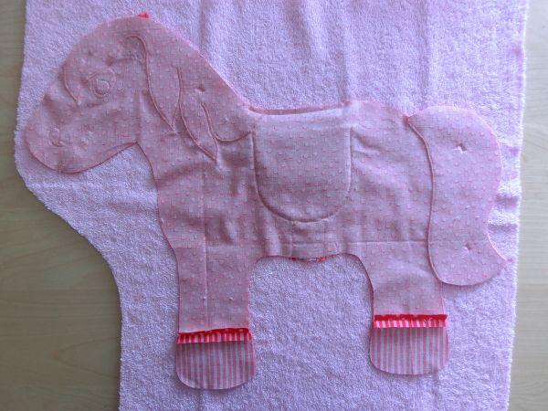 Sew the flap near to the edge at the upper edge to the back of the pony.