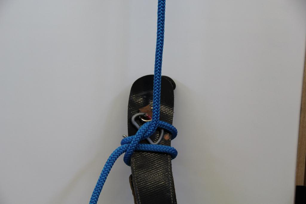 around the standing part of the rope with two half