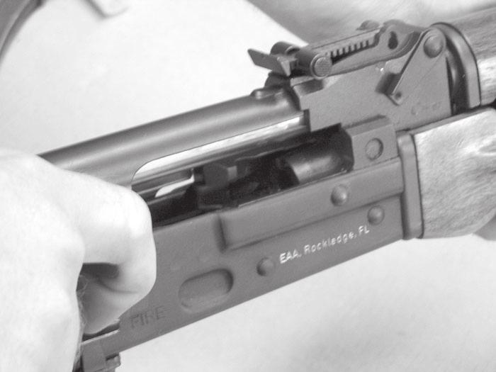Fig 13aa: With the magazine removed move the bolt block safety to it s lower position, slide the bolt to the rearward position via the cocking handle and inspect the chamber to be certain the firearm