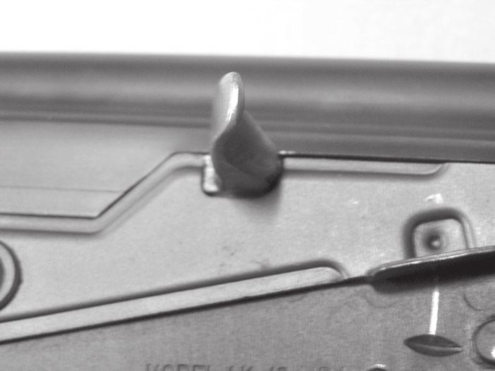 Then pull the bolt handle to the rear and release and the bolt handle and the bolt will strip a round from the magazine.