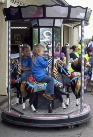 Great choice for corporate, school or church events. Three Horse Carousel Great for children ages 1 10 years. Dimensions: 6 feet diameter by 9 feet tall. Requires flat paved surface for setup. $350.