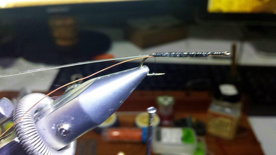 The other is to tie a nylon loop under the tail to prevent the zonker tail from wrapping around the bend of the hook. This latter option is now preferred. So: a.