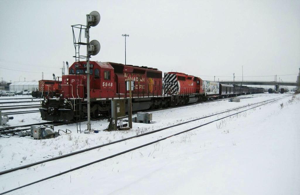 SD40-2 s # 5648 & 6058 back the Olympic Container Car plus 10 cars from the Royal Canadian