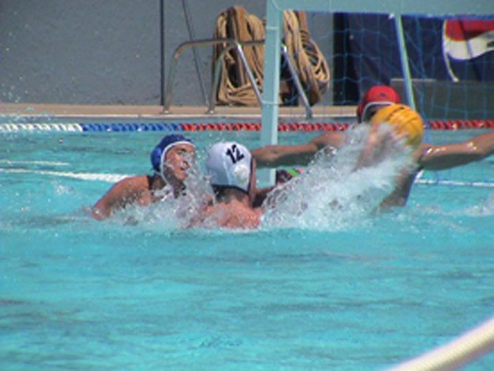 HOW WATER POLO IS PLAYED One important rule is that the ball can only be handled by one hand at a time.