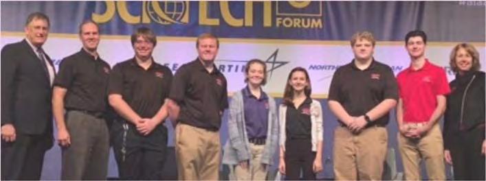 The students are pictured here (from left to right) with the Director of the AIAA, their instructor Joel Bresler, Carter Brown, Michael Mullens, Kristin Clements, Katie Esker, Daniel Smith, Scottie