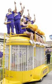 Traditionally, Mike rides through Tiger Stadium in a travel trailer topped by the LSU cheerleaders before home games.