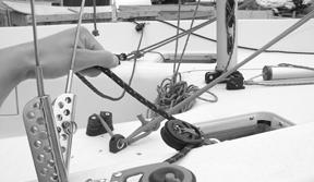 which are labeled, head, tack and clew for easy recognition. 4. Untie the spinnaker tack line from the bow eye.