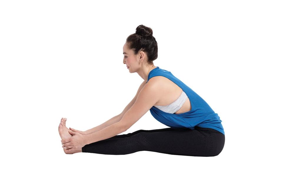 2. Exhale and twist toward the inside of the right thigh.