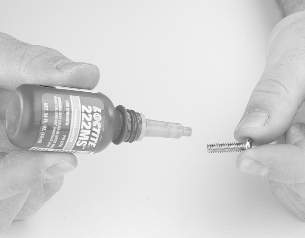 Using the stainless or brass wire brush clean all residual Loctite from all screws. Thoroughly inspect all threaded surfaces for corrosion or degradation; replace if questionable/required.