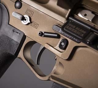 well flare, over-sized integrated trigger guard with grip relief, and QD sling mount.