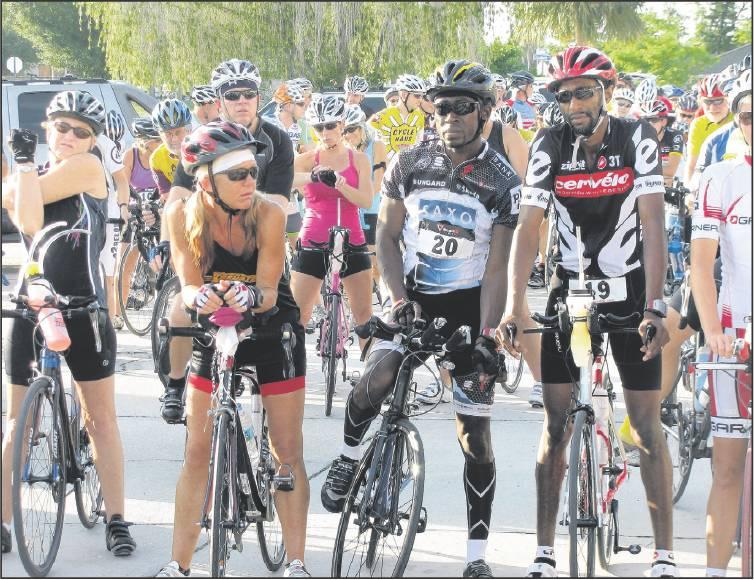 Page 6 of 6 SUN PHOTO BY GREG MARTIN Riders get their game faces on prior to the start of the