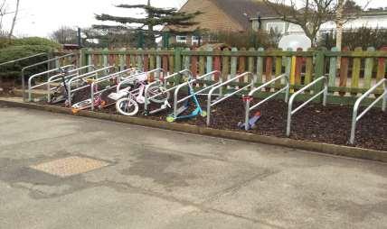 The above photographs show where our pupils leave their scooters and bikes during school time.