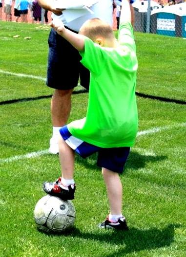 foot trap slow motion ball or junior size soccer ball Have the child place his/her foot on top of the ball and maintain balance before kicking