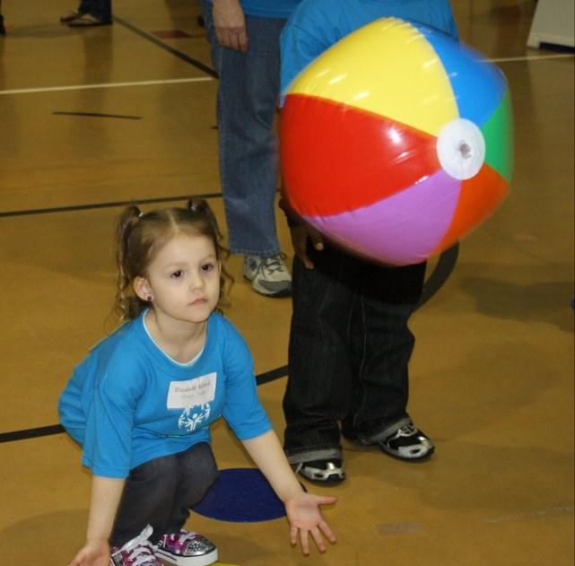 bounce catch beach ball, slow motion ball Face the child and bounce a beach ball or fairly large ball so the child can catch