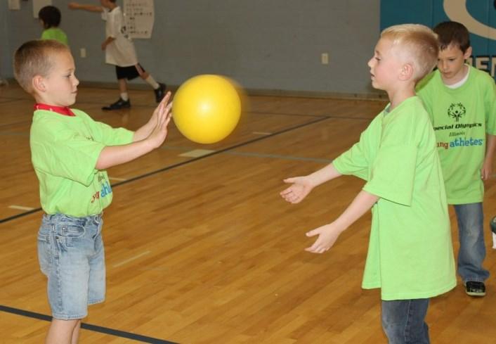 Progress to having the child in a sideways, ready position. Toss beach ball to the child and have him/ her hit the ball with an open hand.