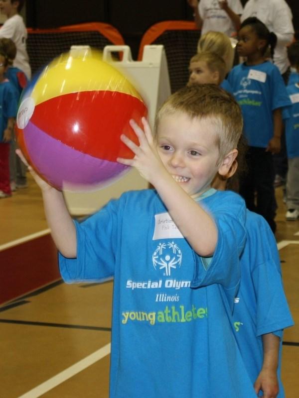 dribble beach ball, slow motion ball, junior size basketball, playground ball Stand behind the child and assist him/her in continuously bouncing a beach ball with two hands, without