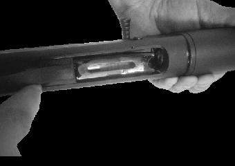 Release the bolt by pressing the button located toward the front of the receiver (photo 10).