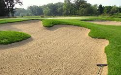 Enter and leave the bunker from the lowest edge. The pronged edge of the rake is for the base of the bunker only.