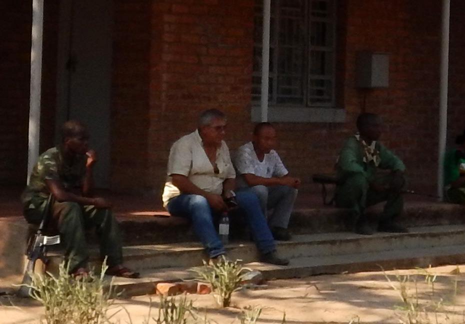 Mozambican (Jose Manuel) and Chinese National (Ying Lee) under arrest at Lengwe National Parks Headquarters for the illegal extraction of Mopane hardwood from Malawi into Mozambique.