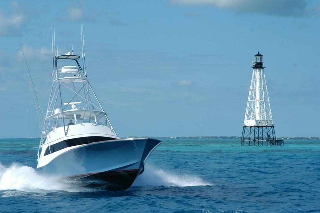 QUE MAS 70 Traditional By John Brownlee, Marlin Magazine, As Capt. Travis Butters steered the 70-foot American Custom Yacht Que Mas along the reef, I glanced over at the GPS.