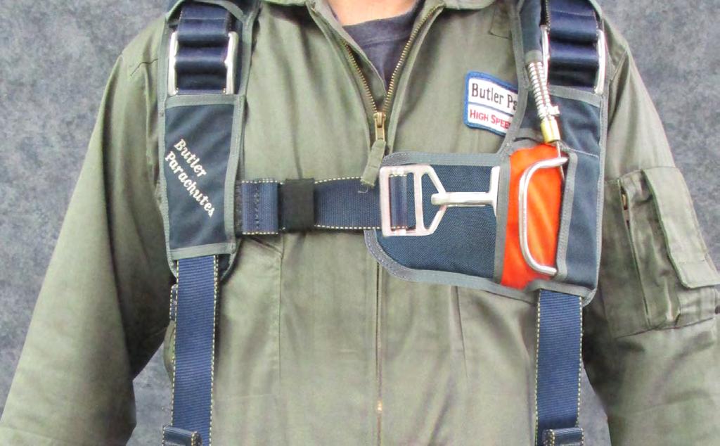 6.1 Put the harness on like you would a jacket. Attach the chest strap buckle and adjust it for a snug fit.
