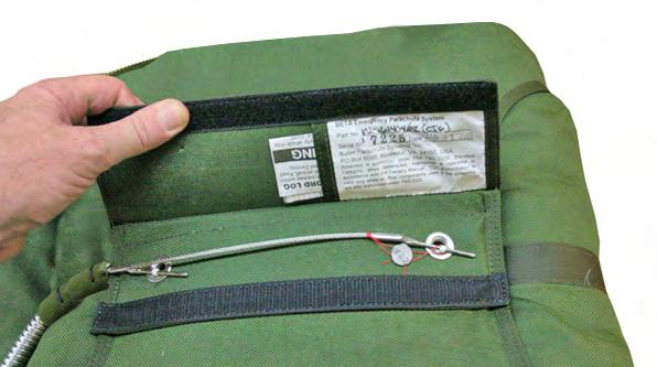 5.1 Peel open the Velcro closure on the pin protector flap and check the packing data card for the repack date and ensure it has been packed within the last 180 days.