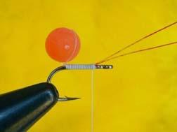 Start the GX2 thread one and one-half hook eye distance back from the hook eye. Lay down a thread base back to the hook bend to a point directly over the hook barb.
