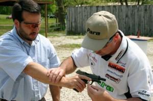 Jarrett checks to make sure the shooter's hand is properly griping the gun and that his wrist is straight.