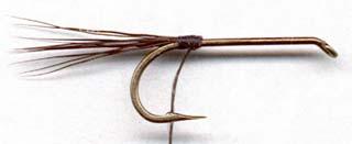 Irresistible Recipe by Kevin Cohenour HOOK: Mustad 94840 or equivalent, size 8 to 22 THREAD: Strong 6/0 or 3/0 TAIL: Brown and grizzly dry fly hackle fibers mixed, or moose body hairs BODY: Natural