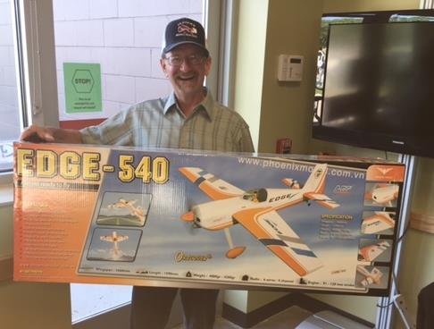 The Gal-O-Fuel was won by Patrick Deuser, and the Edge 540 raffle was taken away by Gary Webber shown below: Martin said attention probably will shift to model cars for the winter, since weather soon
