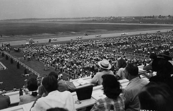 Some of the Goodyear racers taxi by the stands before the start of the 1947 Goodyear race.